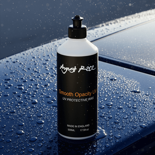 Bottle of August Race UV Protective Wax on a boat deck with water droplets.