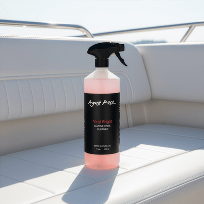 Bottle of August Race Vinyl Bright vinyl cleaner and restorer on a vinyl boat cushion.