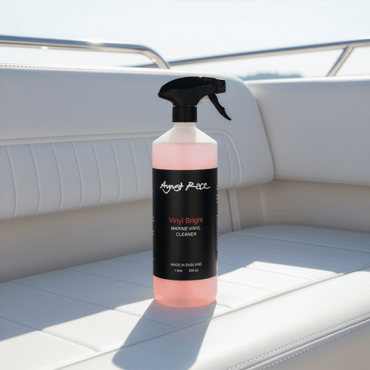 Bottle of August Race Vinyl Bright vinyl cleaner and restorer on a vinyl boat cushion.