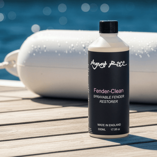 August Race Fender-Clean bottle on dock with water in the background